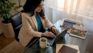 Real estate agent typing listing description at home office