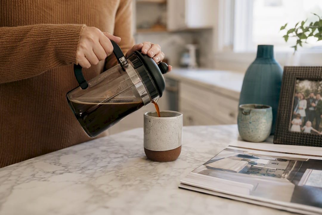 Homeowner preparing coffee amid busy day